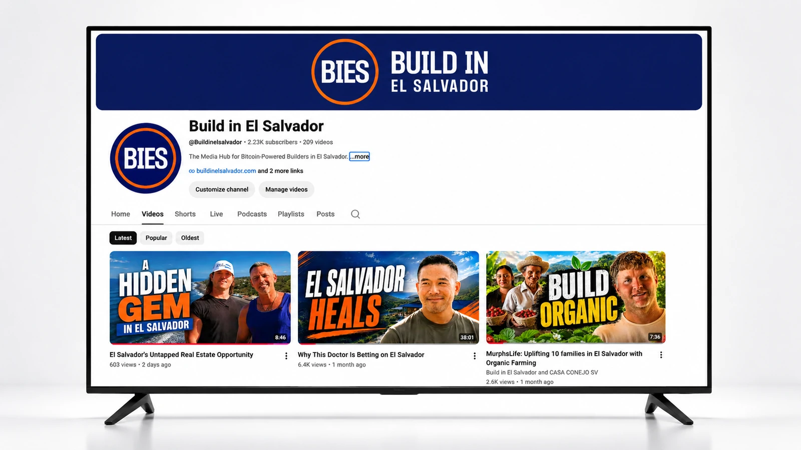 The Build in El Salvador YouTube channel shown on a screen